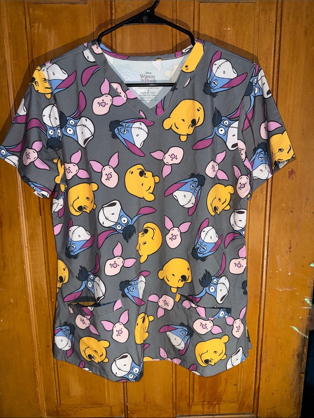 Disney Winnie the Pooh Gray Scrub Top with Yellow, Pink & Blue Character Faces